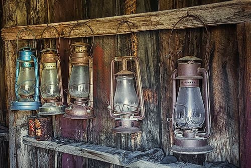 Antique lanterns-Bodie State Historic Park viewed through window-California Art Print by Adam Jones